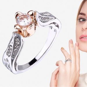 $5 FLOWER RING STERLING COATED. NEW. SIZE 7. $5 IF BUNDLED